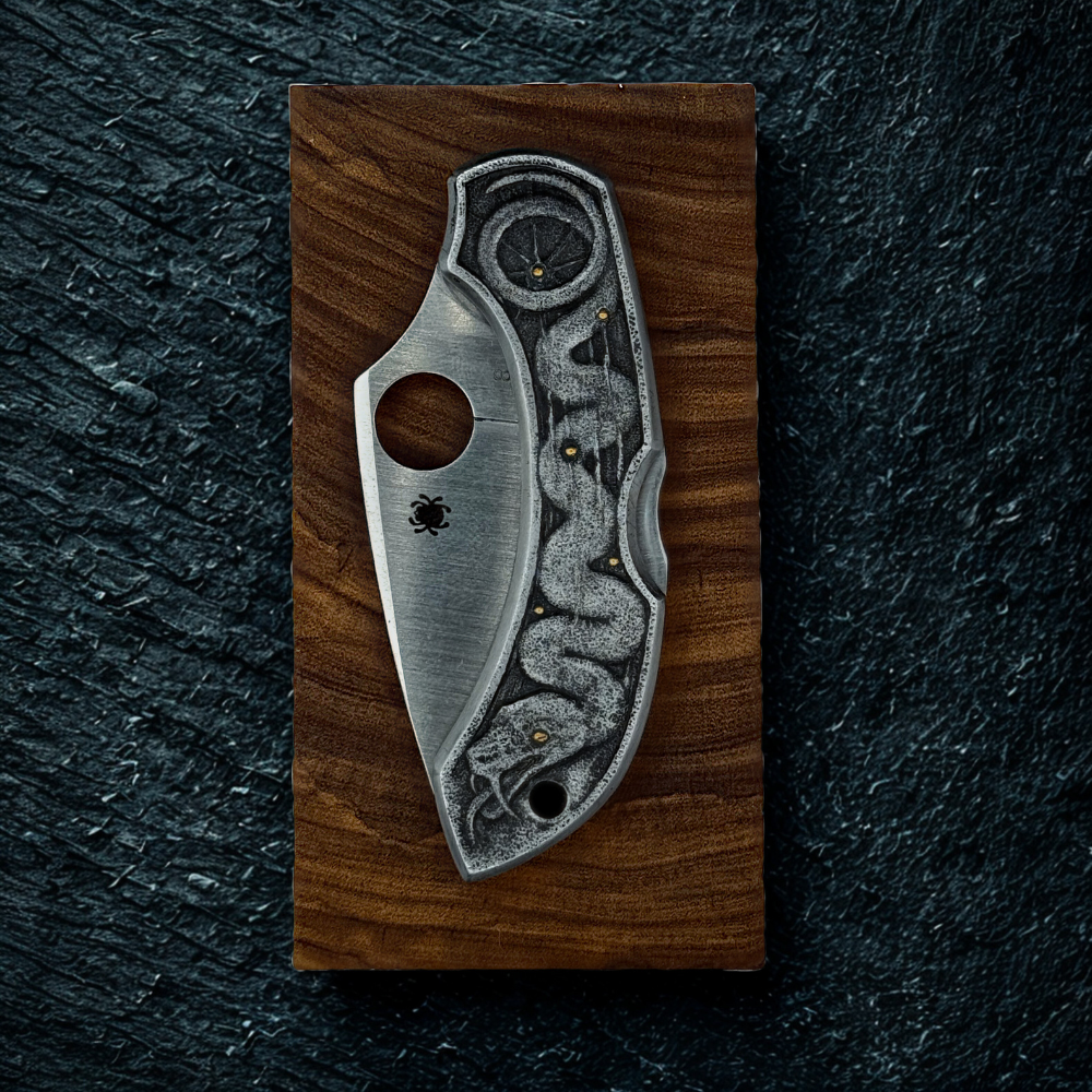 Silver pocket knife on a wooden stand against a dark textured background