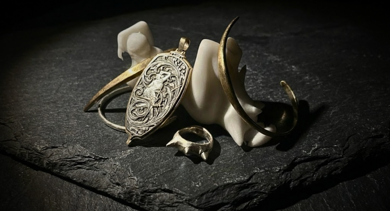 Decorative ring with intricate design on a dark stone surface