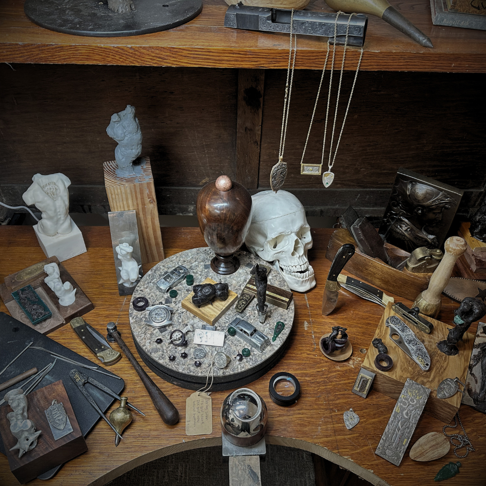 Metal compass on a textured black background