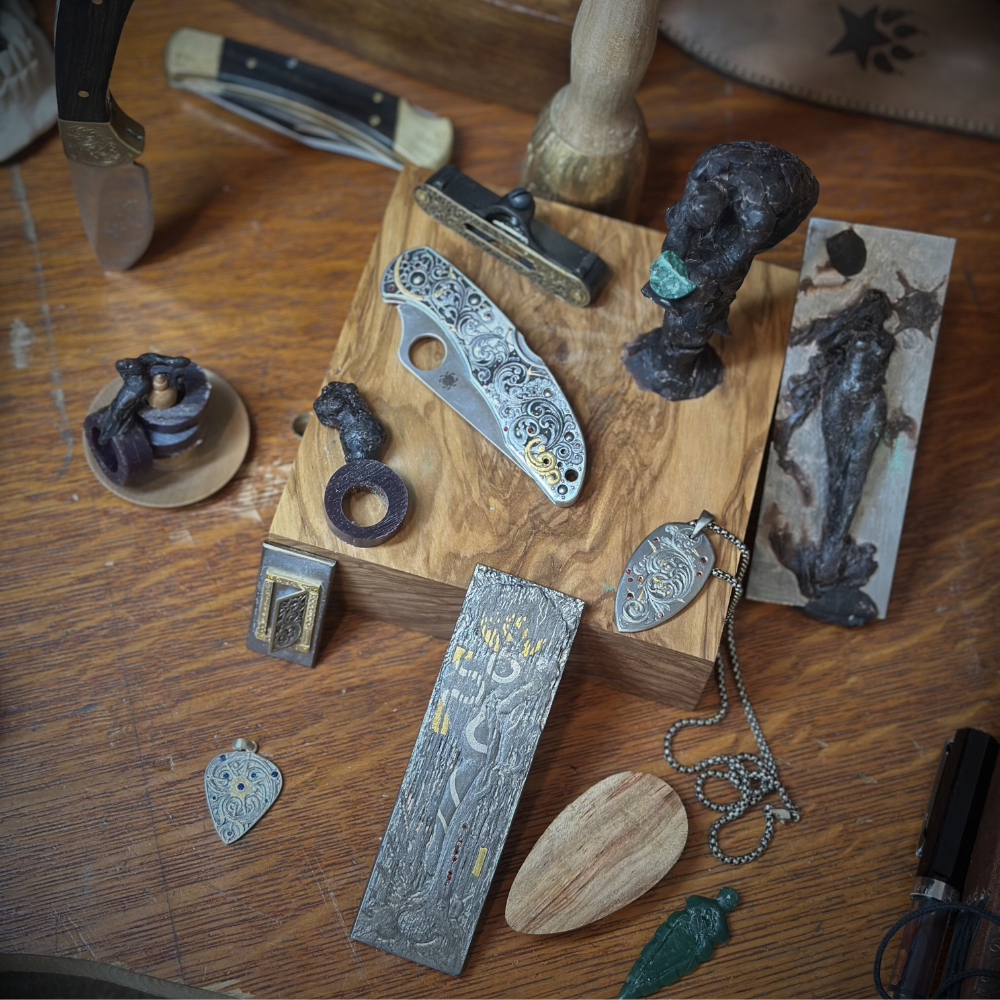 Collection of metalworking tools and jewelry components on a wooden surface